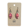 Pair of pink and gold ceramic earrings on a 'The Artifact House' branded card.