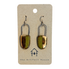 Pair of gold and green earrings on a card with 'The Artifact House' branding.