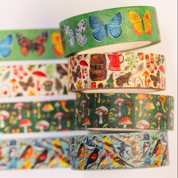 Set of colorful washi tape rolls with nature-themed designs on a white background