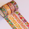 Three rolls of colorful washi tape with fruit and honeycomb patterns on a white background.