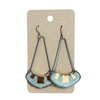 Pair of earrings on a display card with a beige background