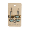 Pair of earrings on a card with 'The Artifact House' branding