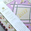 2027 planner with decorative cover and gold text on a white background