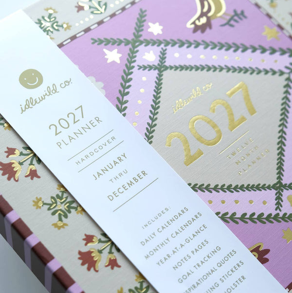 2027 planner with decorative cover and gold text on a white background