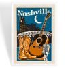 A framed Nashville cityscape poster with an acoustic guitar, cowboy boots, a microphone, and a crescent moon under a starry night sky. The word "Nashville" appears at the top.
